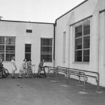 Washington Boulevard school, Elementary activities. Children lined up to go on bar.