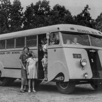[Students on board a school bus.]