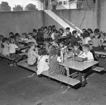 [54th] Fifty-fourth street school activities. Eating lunch in the pergola.