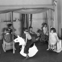 32nd Street school, kindergarten activities.  [Playing] merry-go-round made