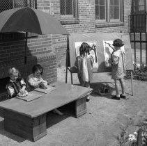 32nd Street school, kindergarten activities. Painting and modeling clay, in