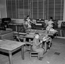 Washington Boulevard school, Elementary activities. Children working at carpentry benches.