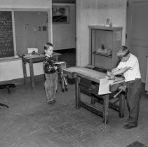 Washington Boulevard school, Elementary activities. Two boys working at carpenter bench.