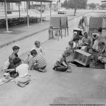Summer classes at Chapman Avenue school.  Children constructing a little slide screen [for projector].