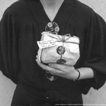 Christmas party, Cahuenga School.  Present given by a child. (Close-up, showing card written.)
