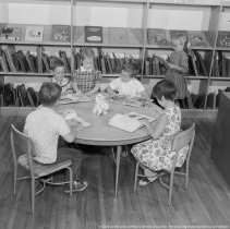 Elementary library activities, [Reading books].  Sherman Oaks elementary library with and without pupils.