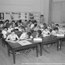 Sterry school activities.  Class getting out school newspaper [Wee Bruin].