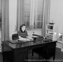 Nora Sterry school activities.  School nurse at her office desk alone, and inconference with P.T.A. [Parent Teacher Association, PTA] representative etc.