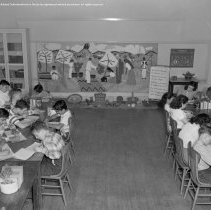 Sterry school activities.  Special education.  Pupils engaged in various classroom activities [students writing about a Mexican, Mexico culture display, mural, history class].