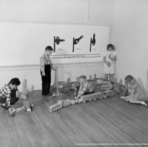 Sterry school activities.  Special education.  Pupils engaged in various classroom activities [students playing with trains, wooden trains, train signals].
