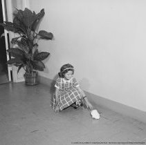 Thrift, conservation and school savings pictures. Child picking up paper from a clean floor.