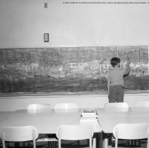 Class activities at Bellagio Road Elementary School.  Students and teachers are shown using the library facilities, music instruction, using audio visual equipment, playing musical instruments, and art.