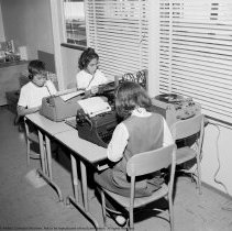 Various class activities at Bellagio Road School; reading, writing, mathematics, art study, using audio visual equipment, studying science.