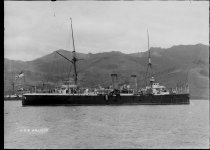 HMS Wallaroo in Akaroa Harbour. T.E. Taylor studio, c.1896-1910.