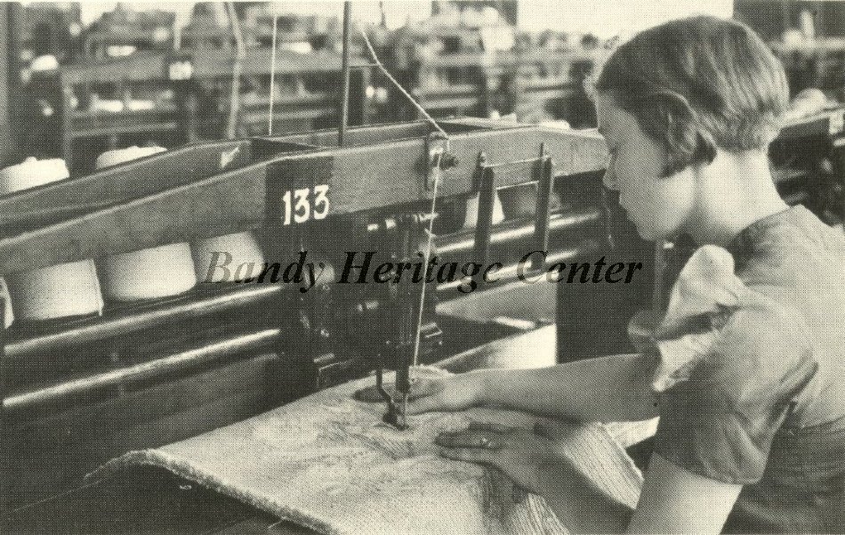 Chenille factory worker sewing in pattern using single needle machine, 1928 (2010.003.0010)