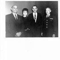 Sally Sawaya with three men.  Can you identify anyone here?