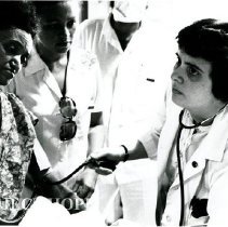 Drs. Sgroi and six-year medical students making the ward rounds on SS HOPE