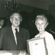 Mrs. Helen Walsh with first ALumni Association Award, Dr. "Red" Diskan