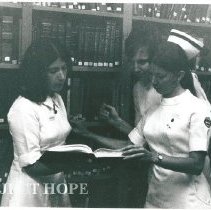 Nurses in library.