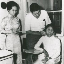 Dr. Walsh with patient, Viet Nam - Voyage I