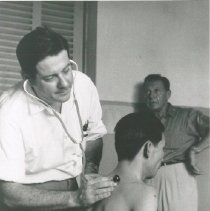 Dr. Walsh with patient, Viet Nam - Voyage I