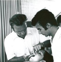 Dr. Schonfield treating a patient, assisted by his local counterpart.