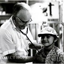 Dr. Carl Fischer, pediatrician with a young patient.