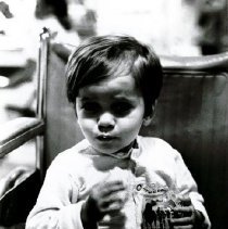 Avenoide Barbosa da Silva drinking his HOPE milk and eating cookies.