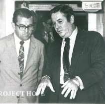 Dr. Walsh walking with the Minister.  The Minister speaks fluent English.