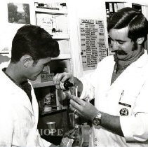 Earl Rogers, pharmacist and worker, trainee, counterpart, Oswaldo Davi.