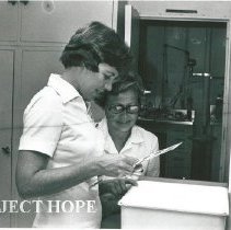 Linda Warren, dental hygienist with Mrs. Miller, wife of Dr. Baxter Miller