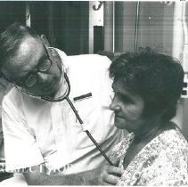 Dr. Monford Custer and a patient on the female ward.