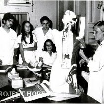 Medical technologist, Marie Storaasli, instructs class with plastic model