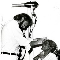 Ophthalmologist John S. Barker, MD examines patient in Maceio, Brazil.