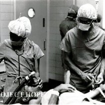 Dr Eastmond Roderique with nurse anesthetist in OR