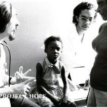 Dr Martin Debeukelaer, Pediatrician, at UMWI Clinic with patients.