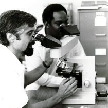 Guy Marrocco, Pathologist,  with a senior graduate student.