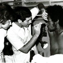 Dr Myles Kreiger exames Jamaican patient while Regina Kreiger looks on.