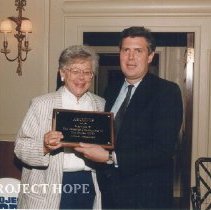 Dr. Jean Kohn with Archive Award from Bill Walsh, Jr. for Alumni Assoc.