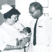 Doris Edwards and Dr Vedhanayakam with first baby born on the HOPE.