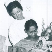 Anne Fangman with first child born aboard the HOPE while in Ceylon.
