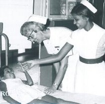 Mary Lou Roppe with Pediatric patient in Colombo, Ceylon General Hospital.