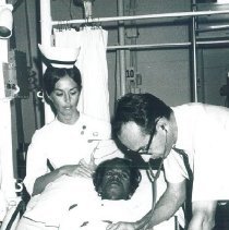 Robert Kradjian and Christine Kradjian with patient on SS HOPE in Ceylon.