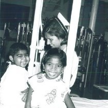 Sylvia Lawrence plays with young patients on SS HOPE in Ceylon.