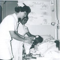 Renata Roeber with counterpart and patient on SS HOPE in Ceylon.