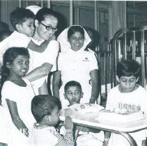 Esther Pierce Kooiman helps a Pediatric patient celebrate a birthday.