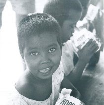 Pediatric patients drinking milk from the SS HOPE in Ceylon.
