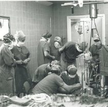 American technicians from HOPE demonstrate a heart-lung machine.