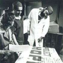 Dr. Robert G. Kettrick (rt) inspecting supplies with Dr. Waldemar Macheta