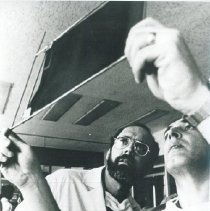 Dr. Kettrick  examining an X-ray with his Polish counterpart Dr. Macheta